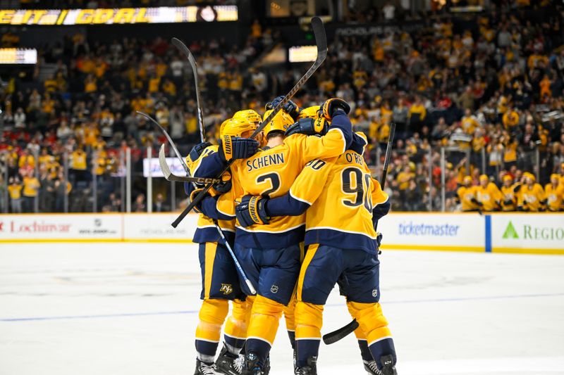 Oct 19, 2024; Nashville, Tennessee, USA; Nashville Predators defenseman Luke Schenn (2) celebrates his goal with his teammates against the Detroit Red Wings during the first period at Bridgestone Arena. Mandatory Credit: Steve Roberts-Imagn Images