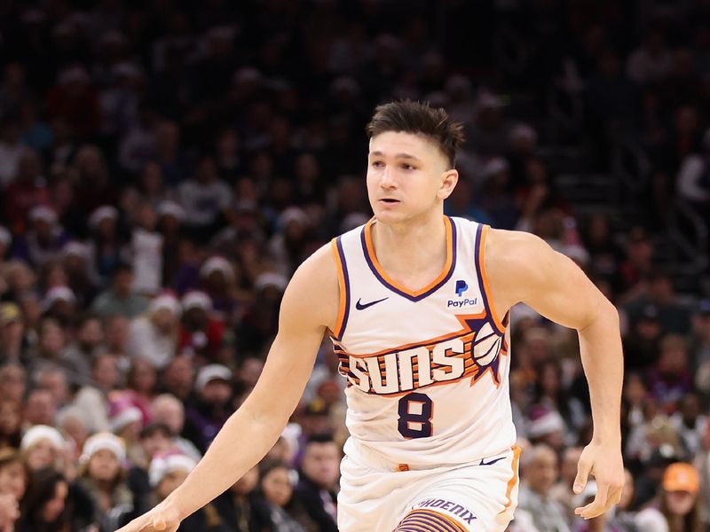 PHOENIX, ARIZONA - DECEMBER 25: Grayson Allen #8 of the Phoenix Suns handles the ball during the second half of the NBA game at Footprint Center on December 25, 2023 in Phoenix, Arizona. The Mavericks defeated the Suns 128-114. NOTE TO USER: User expressly acknowledges and agrees that, by downloading and or using this photograph, User is consenting to the terms and conditions of the Getty Images License Agreement.  (Photo by Christian Petersen/Getty Images)