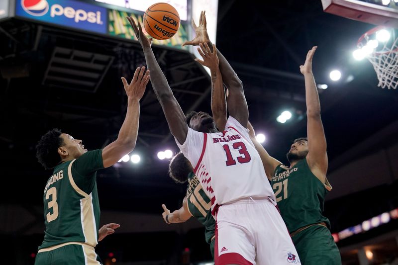 Feb 3, 2024; Fresno, California, USA; Fresno State Bulldogs center Enoch Boakye (13) attempts to gain control of a rebound next to Colorado State Rams guard Josiah Strong (3) and forward Rashaan Mbemba (21) in the second half at the Save Mart Center. Mandatory Credit: Cary Edmondson-USA TODAY Sports