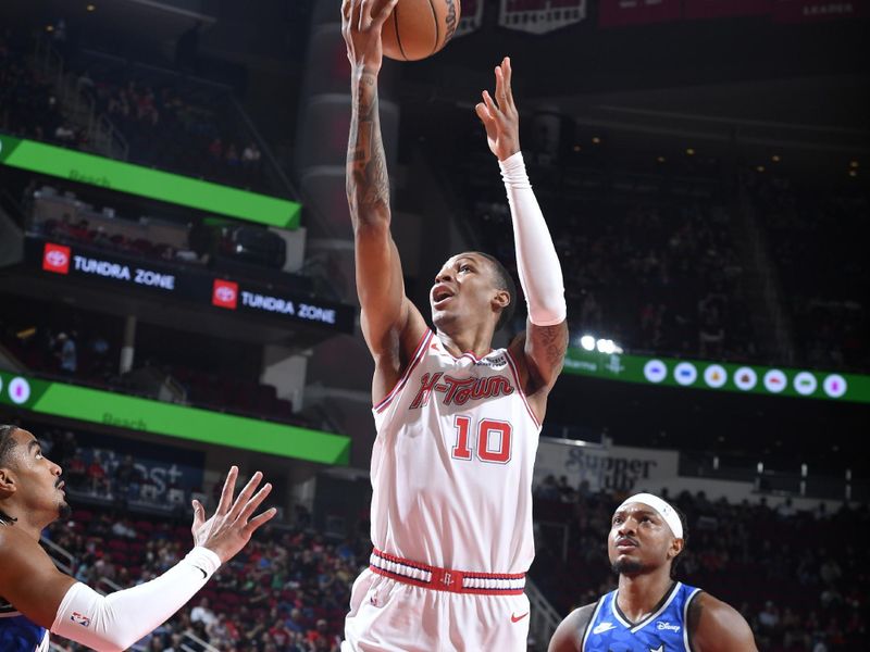 HOUSTON, TX - APRIL 9: Jabari Smith Jr. #10 of the Houston Rockets drives to the basket during the game against the Orlando Magic on April 9, 2024 at the Toyota Center in Houston, Texas. NOTE TO USER: User expressly acknowledges and agrees that, by downloading and or using this photograph, User is consenting to the terms and conditions of the Getty Images License Agreement. Mandatory Copyright Notice: Copyright 2024 NBAE (Photo by Logan Riely/NBAE via Getty Images)