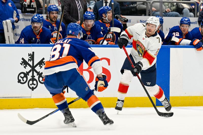 Mar 1, 2026; Elmont, New York, USA; Florida Panthers defenseman Dmitry Kulikov (7) attempts a pass defended by New York Islanders left wing Ondrej Palat (81) during the first period at UBS Arena. Mandatory Credit: Dennis Schneidler-Imagn Images