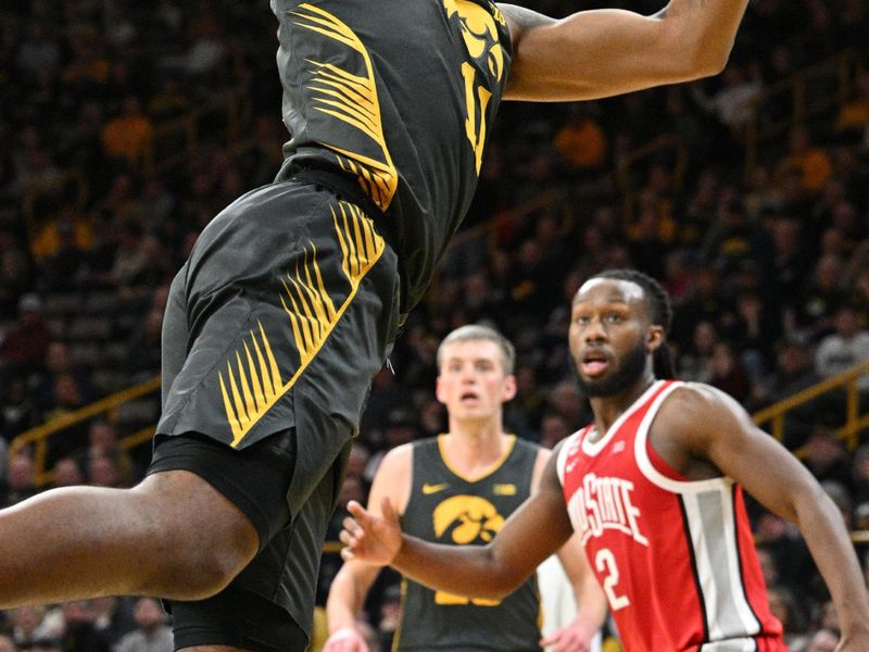 Feb 2, 2024; Iowa City, Iowa, USA; Iowa Hawkeyes guard Tony Perkins (11) shoots the ball against the Ohio State Buckeyes during the second half at Carver-Hawkeye Arena. Mandatory Credit: Jeffrey Becker-USA TODAY Sports