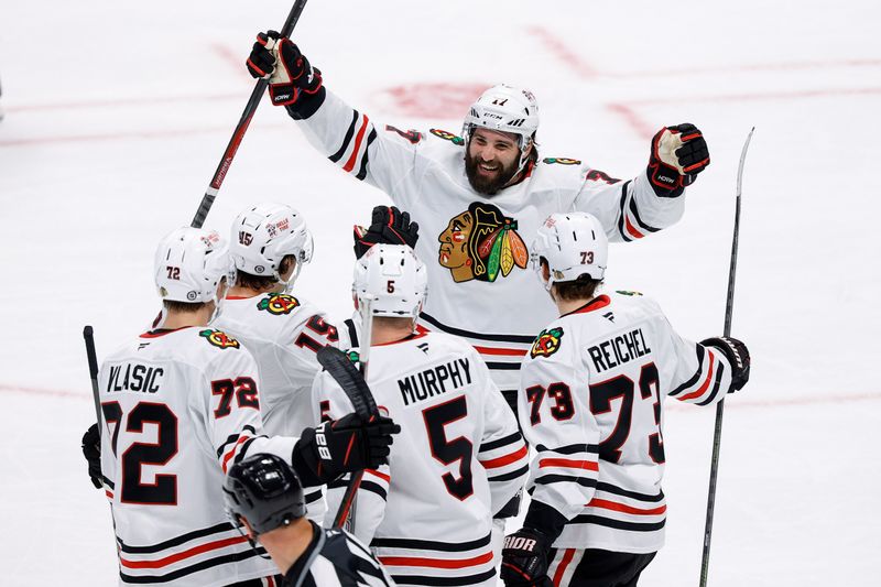 Oct 28, 2024; Denver, Colorado, USA; Chicago Blackhawks left wing Patrick Maroon (77) celebrates the goal of left wing Lukas Reichel (73) with defenseman Connor Murphy (5) and center Craig Smith (15) and defenseman Alex Vlasic (72) in the first period against the Colorado Avalanche at Ball Arena. Mandatory Credit: Isaiah J. Downing-Imagn Images