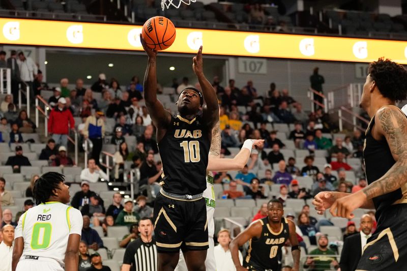 Mar 16, 2024; Fort Worth, TX, USA;  UAB Blazers guard Alejandro Vasquez (10) score a basket against South Florida Bulls guard Jayden Reid (0) during the first half at Dickies Arena. Mandatory Credit: Chris Jones-USA TODAY Sports