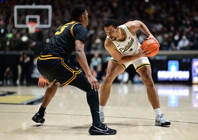 Jan 14, 2026; West Lafayette, Indiana, USA; Purdue Boilermakers forward Trey Kaufman-Renn (4) looks to get past Iowa Hawkeyes forward Cam Manyawu (3) during the second half at Mackey Arena. Mandatory Credit: Marc Lebryk-Imagn Images