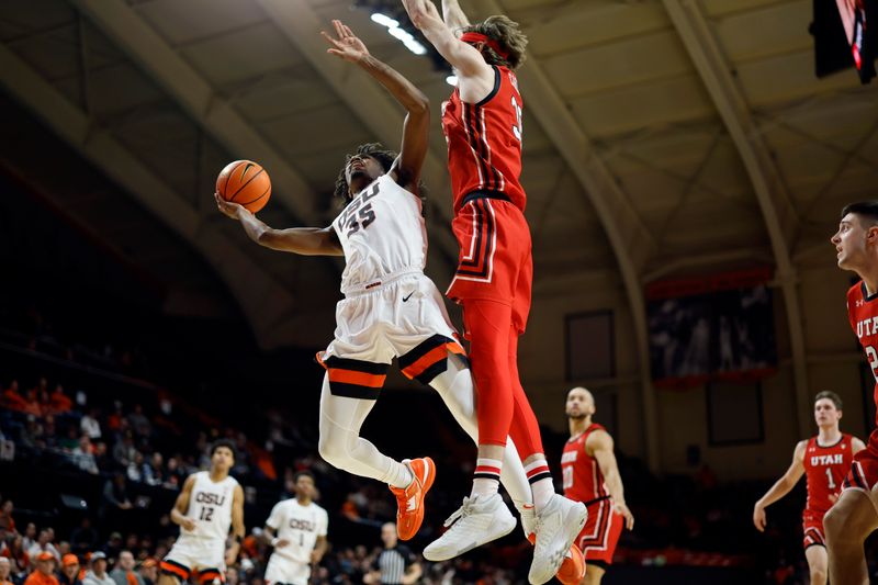 Jan 26, 2023; Corvallis, Oregon, USA; Oregon State Beavers forward Glenn Taylor Jr. (35) shoots under pressure from Utah Utes center Branden Carlson (35) during the first half at Gill Coliseum. Mandatory Credit: Soobum Im-USA TODAY Sports