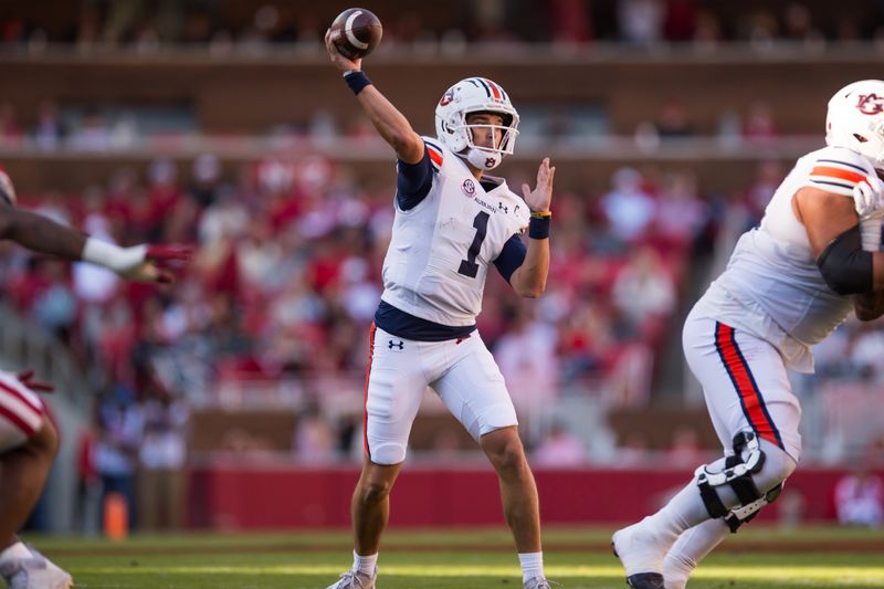 Nov 11, 2023; Fayetteville, Arkansas, USA;  Auburn Tigers quarterback Payton Thorne (1) throws a pass during the first quarter against the Arkansas Razorbacks at Donald W. Reynolds Razorback Stadium. Mandatory Credit: Brett Rojo-USA TODAY Sports