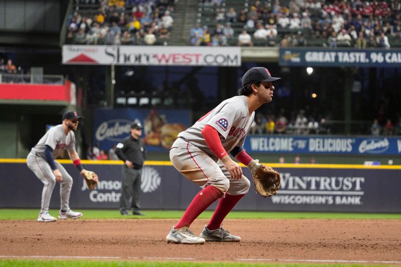 May 27, 2025; Milwaukee, Wisconsin, USA; Boston Red Sox shortstop Marcelo Mayer (39), right and Boston Red Sox shortstop Trevor Story (10) prepare for a hit against the Milwaukee Brewers in the seventh inning at American Family Field. Mandatory Credit: Michael McLoone-Imagn Images