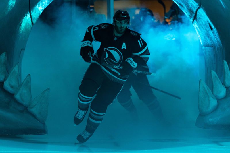 Feb 24, 2024; San Jose, California, USA; San Jose Sharks center Luke Kunin (11) skates onto the ice before the start of the first period against the Nashville Predators at SAP Center at San Jose. Mandatory Credit: Stan Szeto-USA TODAY Sports