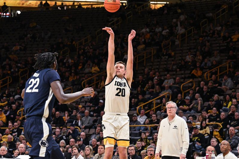 Feb 27, 2024; Iowa City, Iowa, USA; Iowa Hawkeyes forward Payton Sandfort (20) shoots a three point basket as Penn State Nittany Lions forward Qudus Wahab (22) defends and head coach Fran McCaffery looks on during the second half at Carver-Hawkeye Arena. Mandatory Credit: Jeffrey Becker-USA TODAY Sports