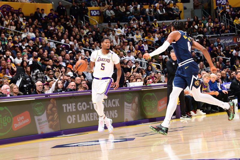 LOS ANGELES, CA - NOVEMBER 23: Cam Reddish #5 of the Los Angeles Lakers dribbles the ball during the game against the Denver Nuggets on November 23, 2024 at Crypto.Com Arena in Los Angeles, California. NOTE TO USER: User expressly acknowledges and agrees that, by downloading and/or using this Photograph, user is consenting to the terms and conditions of the Getty Images License Agreement. Mandatory Copyright Notice: Copyright 2024 NBAE (Photo by Adam Pantozzi/NBAE via Getty Images)