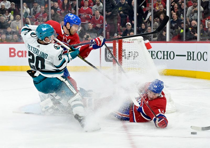 Jan 11, 2024; Montreal, Quebec, CAN; Montreal Canadiens defenseman Mike Matheson (8) and teammate forward Nick Suzuki (14) crash the net of San Jose Sharks goalie Mackenzie Blackwood (29) during the third period at the Bell Centre. Mandatory Credit: Eric Bolte-USA TODAY Sports