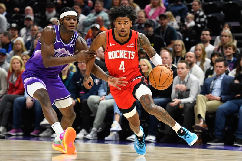 SALT LAKE CITY, UTAH - MARCH 29: Jalen Green #4 of the Houston Rockets drives past Taylor Hendricks #0 of the Utah Jazz during the first half of a game at Delta Center on March 29, 2024 in Salt Lake City, Utah. NOTE TO USER: User expressly acknowledges and agrees that, by downloading and or using this photograph, User is consenting to the terms and conditions of the Getty Images License Agreement.  (Photo by Alex Goodlett/Getty Images)