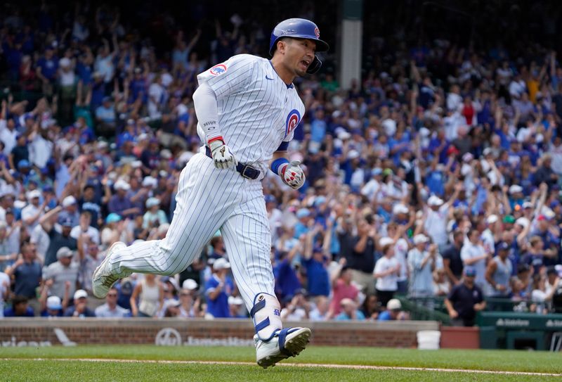 Jul 24, 2024; Chicago, Illinois, USA; Chicago Cubs outfielder Seiya Suzuki (27) runs the bases after hitting a home run against the Milwaukee Brewers during the third inning at Wrigley Field. Mandatory Credit: David Banks-USA TODAY Sports