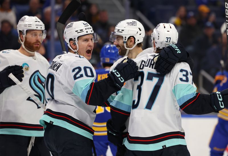 Jan 9, 2024; Buffalo, New York, USA;  Seattle Kraken center Yanni Gourde (37) celebrates his goal with teammates during the first period against the Buffalo Sabres at KeyBank Center. Mandatory Credit: Timothy T. Ludwig-USA TODAY Sports