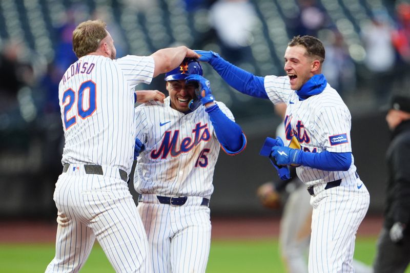 Apr 4, 2024; New York City, New York, USA; New York Mets first baseman Pete Alonso (20) and third baseman Zack Short (21) congratulate left fielder Tyrone Taylor (15) for the winning hit against the Detroit Tigers during the ninth inning at Citi Field. Mandatory Credit: Gregory Fisher-USA TODAY Sports