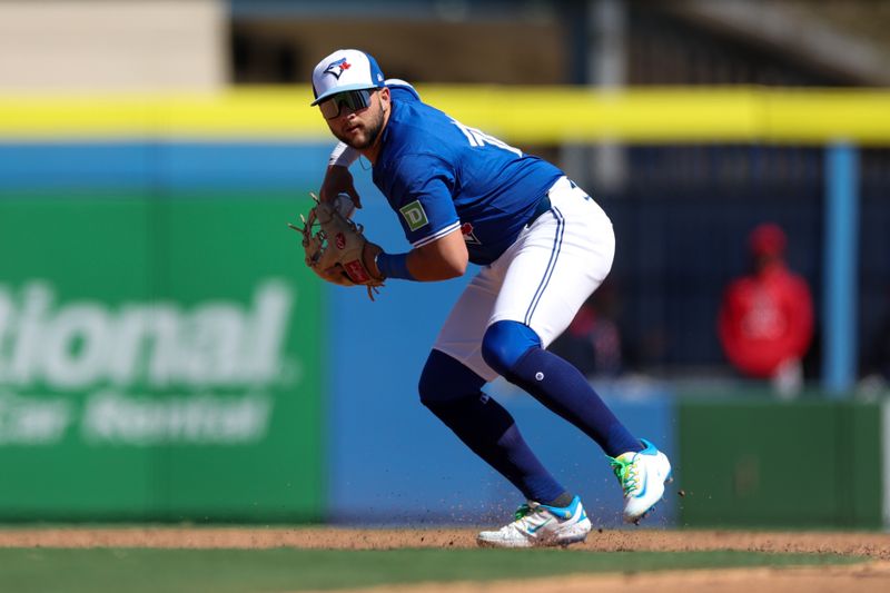 Mar 6, 2025; Dunedin, Florida, USA; Toronto Blue Jays shortstop Bo Bichette (11) throws to first base against the Boston Red Sox in the third inning during spring training at TD Ballpark. Mandatory Credit: Nathan Ray Seebeck-Imagn Images