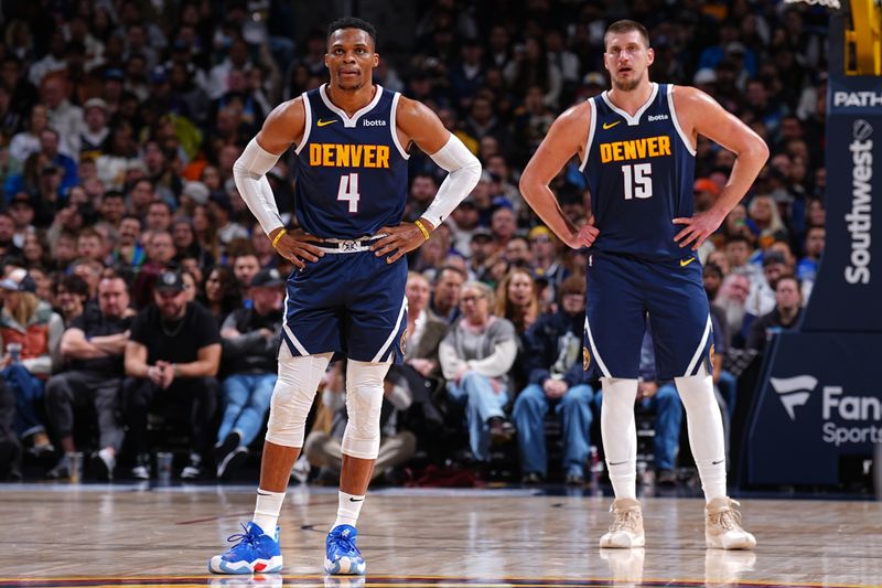 DENVER, CO - NOVEMBER 10: Russell Westbrook #4 and Nikola Jokic #15 of the Denver Nuggets look on during the game against the Dallas Mavericks on November 10, 2024 at Ball Arena in Denver, Colorado. NOTE TO USER: User expressly acknowledges and agrees that, by downloading and/or using this Photograph, user is consenting to the terms and conditions of the Getty Images License Agreement. Mandatory Copyright Notice: Copyright 2024 NBAE (Photo by Garrett Ellwood/NBAE via Getty Images)