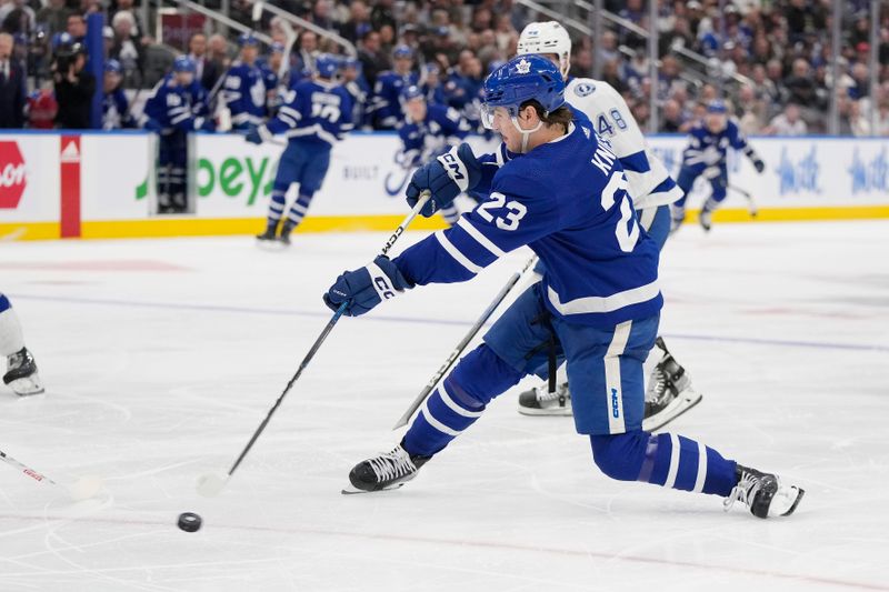 Nov 6, 2023; Toronto, Ontario, CAN; Toronto Maple Leafs forward Matthew Knies (23) shoots the puck against the Tampa Bay Lightning during the third period at Scotiabank Arena. Mandatory Credit: John E. Sokolowski-USA TODAY Sports