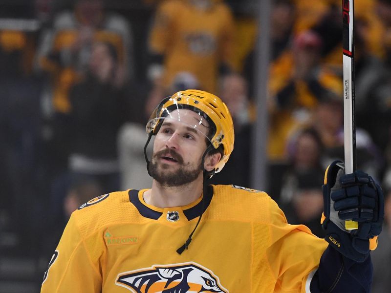 Mar 23, 2024; Nashville, Tennessee, USA; Nashville Predators left wing Filip Forsberg (9) celebrates after a win against the Detroit Red Wings at Bridgestone Arena. Mandatory Credit: Christopher Hanewinckel-USA TODAY Sports