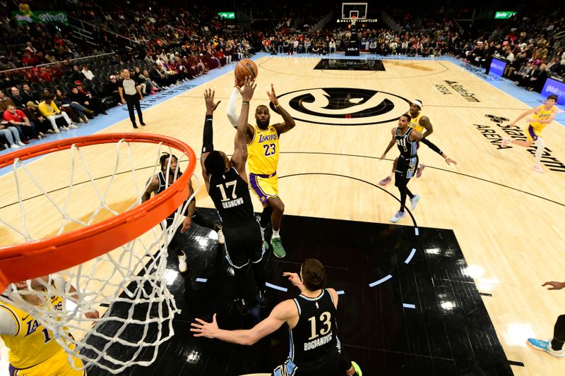 ATLANTA, GA - JANUARY 30: LeBron James #23 of the Los Angeles Lakers shoots the ball during the game  against the Atlanta Hawks on January 30, 2024 at State Farm Arena in Atlanta, Georgia.  NOTE TO USER: User expressly acknowledges and agrees that, by downloading and/or using this Photograph, user is consenting to the terms and conditions of the Getty Images License Agreement. Mandatory Copyright Notice: Copyright 2024 NBAE (Photo by Adam Hagy/NBAE via Getty Images)