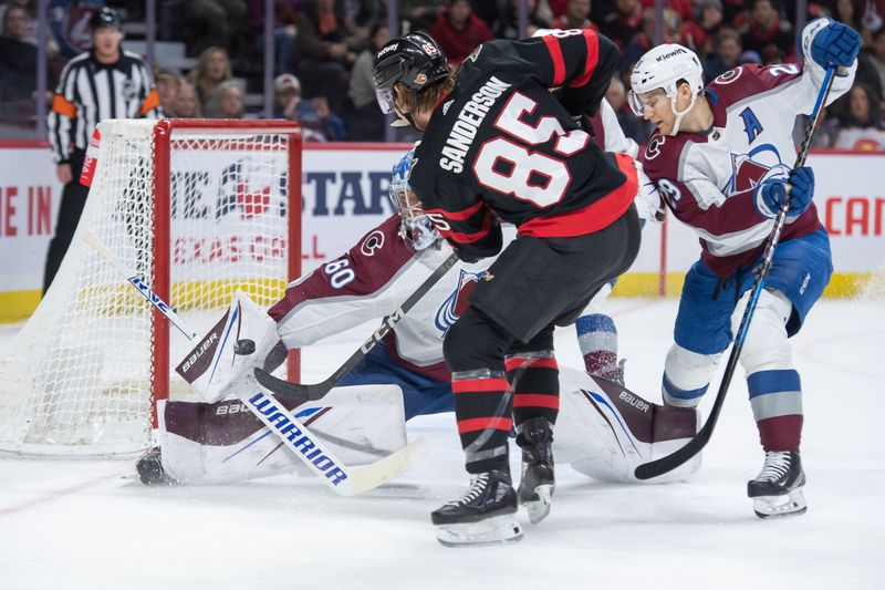 Jan 16, 2024; Ottawa, Ontario, CAN; Colorado Avalanche goalie Justus Annunen (60) makes a save on a shot from Ottawa Senators defenseman Jake Sanderson (85) in the first period at the Canadian Tire Centre. Mandatory Credit: Marc DesRosiers-USA TODAY Sports