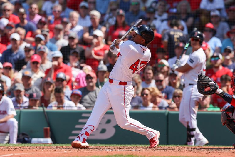 Jun 5, 2024; Boston, Massachusetts, USA; Boston Red Sox second baseman Enmanuel Valdez (47) hits an RBI double during the fifth inning against the Atlanta Braves at Fenway Park. Mandatory Credit: Paul Rutherford-USA TODAY Sports