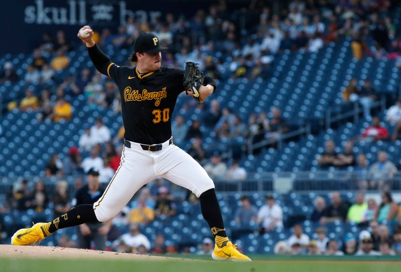 Aug 22, 2024; Pittsburgh, Pennsylvania, USA;  Pittsburgh Pirates starting pitcher Paul Skenes (30) delivers a pitch against the Cincinnati Reds during the first inning at PNC Park. Mandatory Credit: Charles LeClaire-USA TODAY Sports