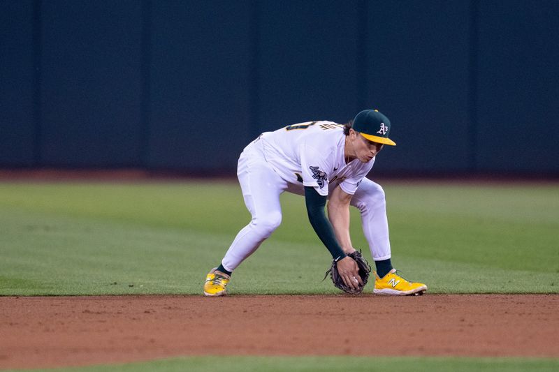 Sep 19, 2023; Oakland, California, USA; Oakland Athletics shortstop Nick Allen (2) fields a ground ball against the Seattle Mariners during the third inning at Oakland-Alameda County Coliseum. Mandatory Credit: Neville E. Guard-USA TODAY Sports