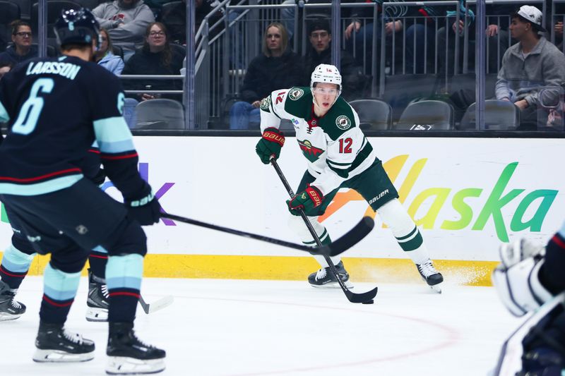 Jan 8, 2026; Seattle, Washington, USA; Minnesota Wild left wing Matt Boldy (12) looks to pass in the first period against the Seattle Kraken at Climate Pledge Arena. Mandatory Credit: Kevin Ng-Imagn Images