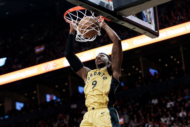 TORONTO, CANADA - MARCH 1: RJ Barrett #9 of the Toronto Raptors dunks against the Golden State Warriors in the first half of their NBA game at Scotiabank Arena on March 1, 2024 in Toronto, Canada.  NOTE TO USER: User expressly acknowledges and agrees that, by downloading and or using this photograph, User is consenting to the terms and conditions of the Getty Images License Agreement. (Photo by Cole Burston/Getty Images)