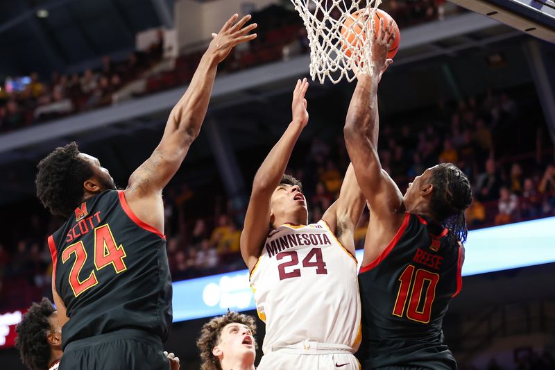 Jan 7, 2024; Minneapolis, Minnesota, USA; Minnesota Golden Gophers guard Cam Christie (24) shoots as Maryland Terrapins forward Julian Reese (10) defends during the first half at Williams Arena. Mandatory Credit: Matt Krohn-USA TODAY Sports