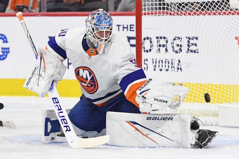 Sep 26, 2024; Philadelphia, Pennsylvania, USA; New York Islanders goaltender Marcus Hogberg (50) makes a save against the Philadelphia Flyers during the second period at Wells Fargo Center. Mandatory Credit: Eric Hartline-Imagn Images