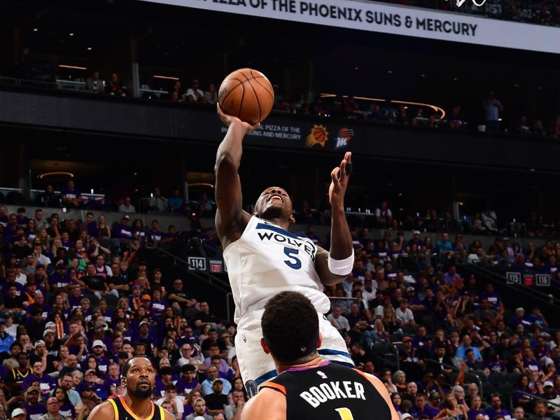 PHOENIX, AZ - APRIL  26: Anthony Edwards #5 of the Minnesota Timberwolves drives to the basket during the game against the Phoenix Suns on April 26, 2024 at Footprint Center in Phoenix, Arizona. NOTE TO USER: User expressly acknowledges and agrees that, by downloading and or using this photograph, user is consenting to the terms and conditions of the Getty Images License Agreement. Mandatory Copyright Notice: Copyright 2024 NBAE (Photo by Kate Frese/NBAE via Getty Images)