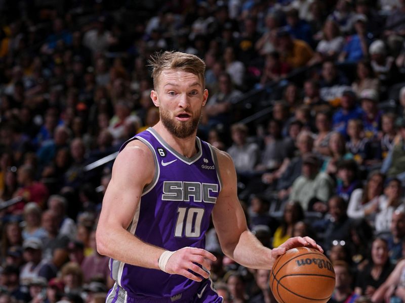 DENVER, CO - APRIL 9: Domantas Sabonis #10 of the Sacramento Kings dribbles the ball during the game against the Denver Nuggets on April 9, 2023 at the Ball Arena in Denver, Colorado. NOTE TO USER: User expressly acknowledges and agrees that, by downloading and/or using this Photograph, user is consenting to the terms and conditions of the Getty Images License Agreement. Mandatory Copyright Notice: Copyright 2023 NBAE (Photo by Bart Young/NBAE via Getty Images)