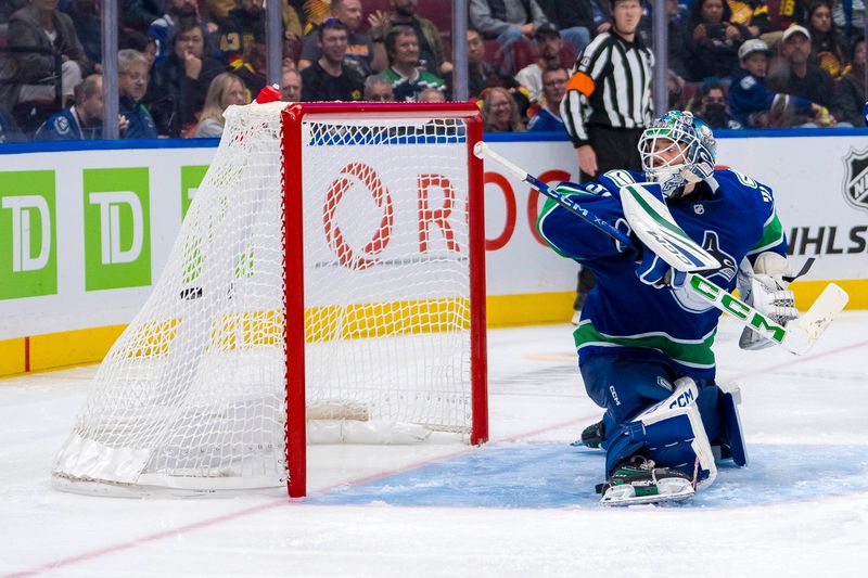 Oct 9, 2024; Vancouver, British Columbia, CAN; Vancouver Canucks goalie Arturs Silovs (31) watches the shot from Calgary Flames forward Martin Pospisil (76) go into the net during the third period at Rogers Arena. Mandatory Credit: Bob Frid-Imagn Images