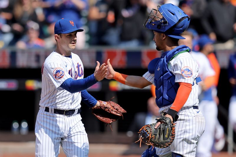 May 18, 2023; New York City, New York, USA; New York Mets relief pitcher David Robertson (30) celebrates with catcher Michael Perez (61) after defeating the Tampa Bay Rays at Citi Field. Mandatory Credit: Brad Penner-USA TODAY Sports