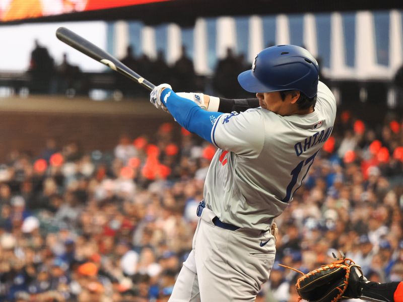 May 14, 2024; San Francisco, California, USA; Los Angeles Dodgers designated hitter Shohei Ohtani (17) hits a solo home run against the San Francisco Giants during the fourth inning at Oracle Park. Mandatory Credit: Kelley L Cox-USA TODAY Sports