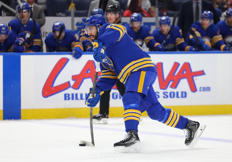 Oct 13, 2025; Buffalo, New York, USA;  Buffalo Sabres defenseman Conor Timmins (21) takes a shot on goal during the second period against the Colorado Avalanche at KeyBank Center. Mandatory Credit: Timothy T. Ludwig-Imagn Images