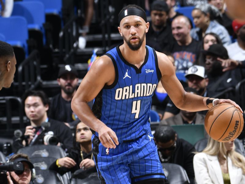 ORLANDO, FL - FEBRUARY 27: Jalen Suggs #4 of the Orlando Magic dribbles the ball during the game against the Brooklyn Nets on February 27, 2024 at the Kia Center in Orlando, Florida. NOTE TO USER: User expressly acknowledges and agrees that, by downloading and or using this photograph, User is consenting to the terms and conditions of the Getty Images License Agreement. Mandatory Copyright Notice: Copyright 2024 NBAE (Photo by Fernando Medina/NBAE via Getty Images)