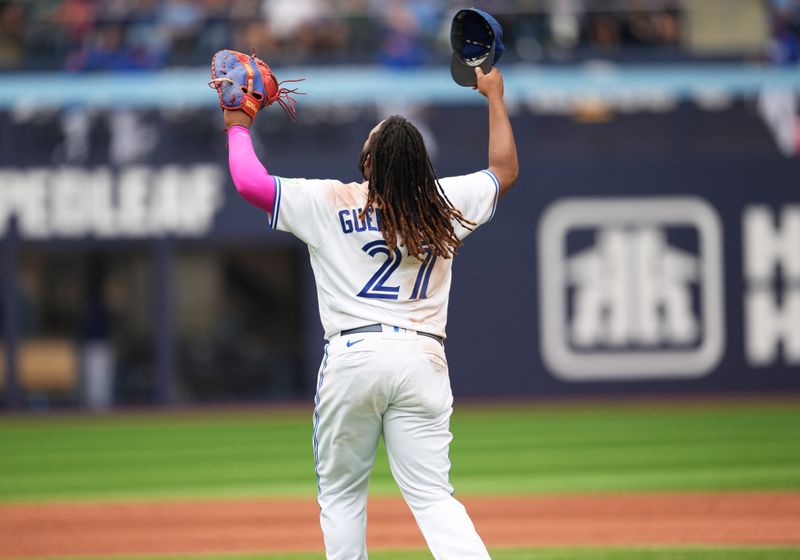 Sep 9, 2023; Toronto, Ontario, CAN; Toronto Blue Jays first baseman Vladimir Guerrero Jr. (27) celebrates the win against the Kansas City Royals at the end of the ninth inning at Rogers Centre. Mandatory Credit: Nick Turchiaro-USA TODAY Sports