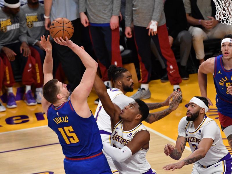 LOS ANGELES, CA - MARCH 2:  Nikola Jokic #15 of the Denver Nuggets shoots the ball during the game against the Los Angeles Lakers on March 2, 2024 at Crypto.Com Arena in Los Angeles, California. NOTE TO USER: User expressly acknowledges and agrees that, by downloading and/or using this Photograph, user is consenting to the terms and conditions of the Getty Images License Agreement. Mandatory Copyright Notice: Copyright 2024 NBAE (Photo by Juan Ocampo/NBAE via Getty Images)