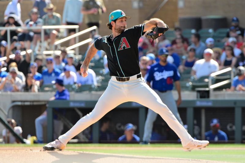 Feb 25, 2026; Salt River Pima-Maricopa, Arizona, USA; Arizona Diamondbacks pitcher Zac Gallen (23) throws in the first inning against the Los Angeles Dodgers at Salt River Fields at Talking Stick. Mandatory Credit: Matt Kartozian-Imagn Images