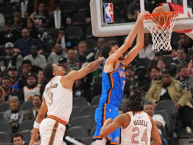 SAN ANTONIO, TX - JANUARY 24: Chet Holmgren #7 of the Oklahoma City Thunder dunks the ball during the game against the San Antonio Spurs on January 24, 2023 at the Frost Bank Center in San Antonio, Texas. NOTE TO USER: User expressly acknowledges and agrees that, by downloading and or using this photograph, user is consenting to the terms and conditions of the Getty Images License Agreement. Mandatory Copyright Notice: Copyright 2024 NBAE (Photos by Jesse D. Garrabrant/NBAE via Getty Images)