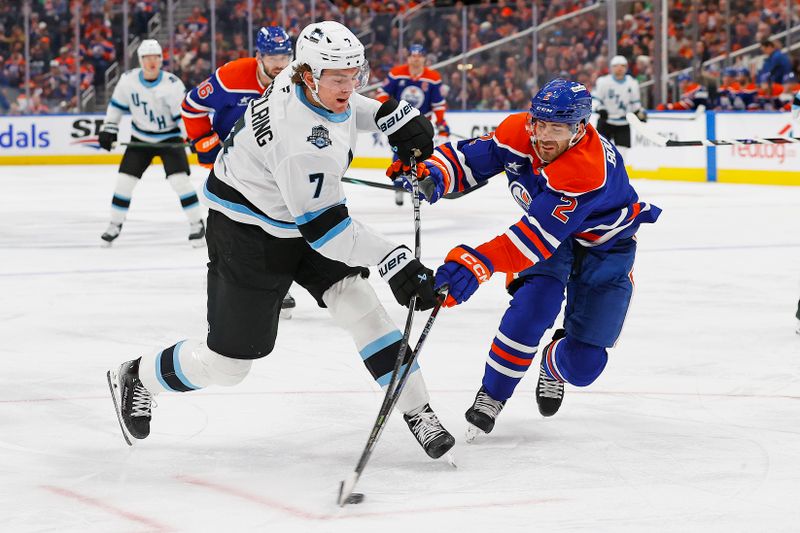 Mar 18, 2025; Edmonton, Alberta, CAN; Edmonton Oilers defensemen Evan Bouchard (2) tries to block a shot by Utah Hockey Club defensemen Michael Kesselring (7) during the second period at Rogers Place. Mandatory Credit: Perry Nelson-Imagn Images