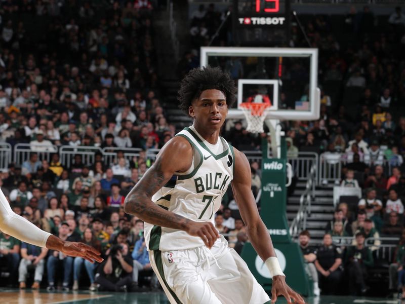 MILWAUKEE, WI - OCTOBER 10: AJ Johnson #77 of the Milwaukee Bucks drives to the basket during the game against the Los Angeles Lakers during a preseason game on October 10, 2024 at Fiserv Forum Center in Milwaukee, Wisconsin. NOTE TO USER: User expressly acknowledges and agrees that, by downloading and or using this Photograph, user is consenting to the terms and conditions of the Getty Images License Agreement. Mandatory Copyright Notice: Copyright 2024 NBAE (Photo by Gary Dineen/NBAE via Getty Images).