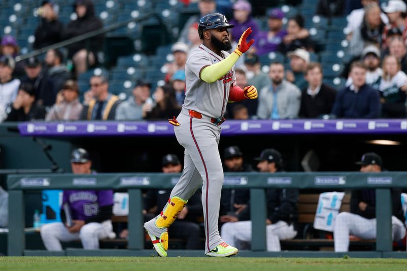 Apr 28, 2025; Denver, Colorado, USA; Atlanta Braves designated hitter Marcell Ozuna (20) runs back to the dugout after hitting a sacrifice fly RBI in the third inning against the Colorado Rockies at Coors Field. Mandatory Credit: Isaiah J. Downing-Imagn Images