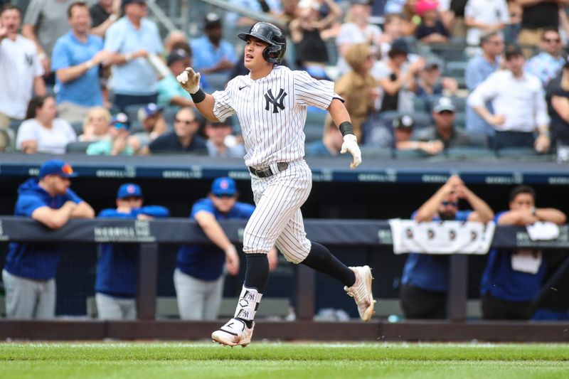 Jul 9, 2023; Bronx, New York, USA;  New York Yankees shortstop Anthony Volpe (11) celebrates after hitting a two-run home run in the sixth inning against the Chicago Cubs at Yankee Stadium. Mandatory Credit: Wendell Cruz-USA TODAY Sports