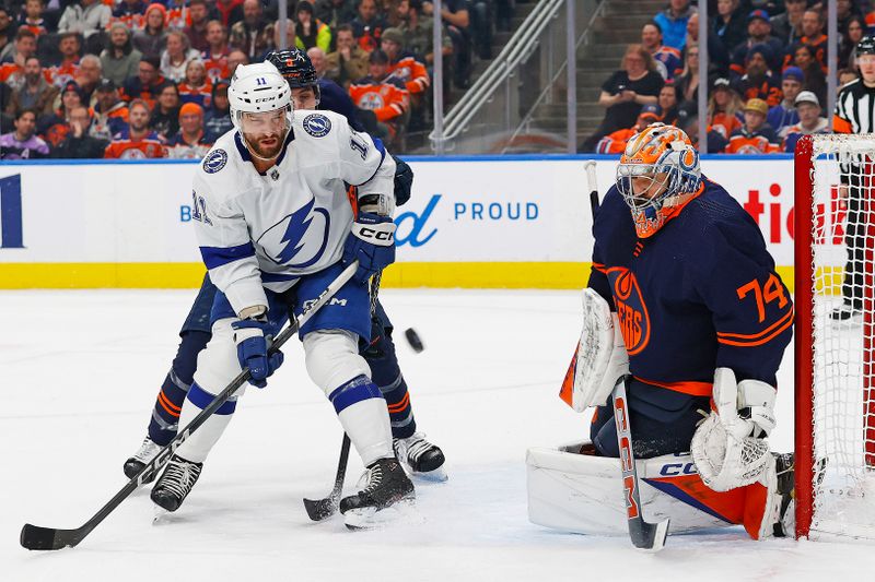 Dec 14, 2023; Edmonton, Alberta, CAN; Tampa Bay Lightning forward Luke Glendening (11) looks for a rebound in front of Edmonton Oilers goaltender Stuart Skinner (74) during the second period  at Rogers Place. Mandatory Credit: Perry Nelson-USA TODAY Sports