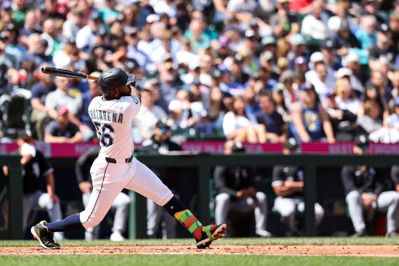 Aug 7, 2025; Seattle, Washington, USA; Seattle Mariners left fielder Randy Arozarena (56) hits a two run home run during the third inning against the Chicago White Sox at T-Mobile Park. Mandatory Credit: Kevin Ng-Imagn Images